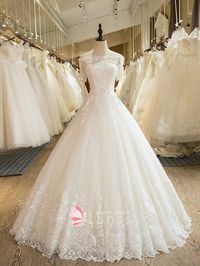 Classic ivory lace off-the-shoulder half length sleeve princess ball gown wedding dress. Custom-made floor length bridal lace ball gown.