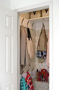 Adding a lower rung of coat racks is perfect for a home with small children as they will be able to easily access their things. #storageideas #declutter #organization #keeporganized #bhg