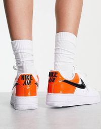 Nike Air Force 1 '07 trainers in white and brilliant orange | ASOS