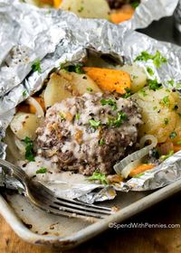 Hobo Dinner Packs are so simple; potatoes, carrots and onions are topped with a seasoned hamburger patty and grilled or baked to tender perfection.