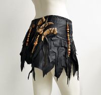 Slashed skirt made put of upcycled and industry leftover leathers. Detailed with artificial bear claws.