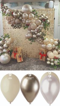 This elegant composition by A showcases the timeless beauty of classic colors. Featuring Gemar balloons in sophisticated shades, the arrangement boasts:  Latte #084 for a touch of warmth and softness.  Prosecco #085, adding a hint of shimmer and celebration.  Latte #084 nestled inside Pearl #028, creating a delightful textural contrast.  Classic colors, never out of style. Old is Gold.