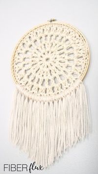 The Natural Granny Wall Hanging Pattern was designed by Fiber Flux. This project was crocheted with Medium Weight Yarn [4] and a 9 mm hook. The finished project measures 9.5 inches across.