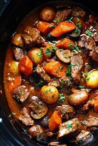 Slow Cooker Beef Bourguignon has crazy tender melt in your mouth beef and hearty veggies slow cooked to perfection in a rich sauce. This meal is comforting and perfect for the cold months ahead! This