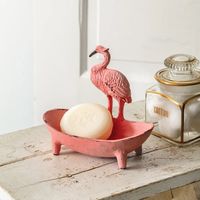 This flamingo soap dish is made of cast iron and is great for adding charm to a powder room.