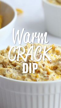 Warm Crack Dip - The ORIGINAL recipe!! Sour cream dip loaded with cheddar, bacon and ranch dip - this stuff is SO addicting! This is always the first thing to go at a party! I could make a meal out of it! Serve with Fritos and tortilla chips! Can make ahead and refrigerate before baking. #dip #partyfood #bacon #appetizer #tailgating