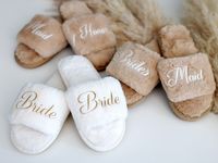 Fluffy slippers is ideal solution to keep you cozy during your Big Day. Cute style and different types of customization with names or initials will work for any occasion: Bachelorette party, Bridal shower, Wedding party, Birthday and Christmas. Bring the best individual gift for your loved once. ♥ Fluffy slippers are available in different colors : ivory, black, coffee, beige, pink, dusty pink, hot pink, mauve, grey, burgundy, royal blue, mint, lavender Sizes:  4.5-5.5US 6-7US 7.5-8.5US 9-10.5US ♥ I offer a customization heat press vinyl . Please choose the option below for your order, put your name, titles, initials or custom text and color of font. I am here to realize your idea - I accept other fonts if you request it.  Colors of vinyl: white, black, gold, silver, pink and other colors