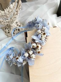 An elegant and delicate wreath is a great option for an accessory for a wedding\birthday\photo shoot. This accessory will make any image unique and inimitable, as it is made of natural flowers. The wreath is made of stabilized flowers that will not wither for a long time (from 3 to 5 years). The wreath is complemented by a satin ribbon. The wreath is securely packed during transportation, which prevents any damage.