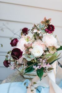 Blush and Burgundy Wedding Bouquet with Hellebore and Ranunculus https://heyweddinglady.com/barn-wedding-blending-modern-glam-rustic-elegance/ #wedding #weddings #weddingideas #engaged #barnweddings #weddingcake #bouquets #bridalbouquets #weddingbouquets