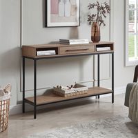 This console table is built for utility and design, featuring an on-trend mix of materials. It's thoroughly modern blackened bronze base adds durable stability, while the warm wood-look tone of the tabletop and shelf adds another dimension of styling.