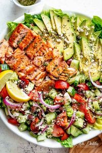 Avocado Salmon Salad with an incredible lemon herb Mediterranean dressing! Loaded with cucumber, olives, tomatoes and feta cheese!