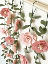 Vertical floral garland wall hangings are a touch of enchantment to a girls room focal wall or as floral Birthday photo backdrop! The second photo shows how a floral wall creates the perfect backdrop for photo shoots that give your treasured moment a lovely airy, magical feel. Ideal