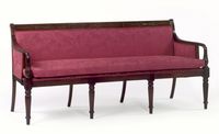 Sheraton style sofa in the style of Samuel McIntire, Salem, Massacusetts, circa 1790-1800 with carved crest rail and turned reeded legs. Shown in mahogany.