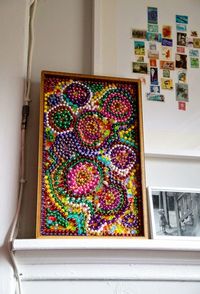 Make this Bead Mosaic for Mardi Gras with colorful strands of beads thrown by admiring on-lookers or more likely purchased at the dollar store.