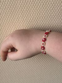 bracelets of pretty red and white flowers in handmade beads