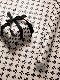 Wrap your gifts in style with our Elegant Bows - Black wrapping paper, featuring a chic and timeless bow pattern that exudes elegance and sophistication. This design showcases classic neutral bows on a black background, creating a striking yet versatile look that's perfect for any occasion. 𝐌𝐚𝐭𝐞𝐫𝐢𝐚𝐥𝐬 ----------------------- All wrapping paper is printed in full color. Matte is printed on a 24# coated bond paper and gloss is 185 gsm. 𝐒𝐢𝐳𝐞𝐬 𝐀𝐯𝐚𝐢𝐥𝐚𝐛𝐥𝐞 ------------------------- 30" x 72" 30" x 180" 𝐇𝐨𝐰 𝐭𝐨 𝐎𝐫𝐝𝐞𝐫 ----------------------------- 1. Select desired size 2. Select paper finish 3. Select Quantity 𝑵𝒐𝒕𝒊𝒄𝒆 - 𝑾𝒉𝒆𝒏 𝒐𝒓𝒅𝒆𝒓𝒊𝒏𝒈 𝒎𝒖𝒍𝒕𝒊𝒑𝒍𝒆 𝒑𝒓𝒐𝒅𝒖𝒄𝒕𝒔, 𝒕𝒉𝒆𝒚 𝒎𝒂𝒚 𝒃𝒆 𝒔𝒉𝒊𝒑𝒑𝒆𝒅 𝒊𝒏 𝒔𝒆𝒑𝒂𝒓𝒂𝒕𝒆 𝒑𝒂𝒄𝒌𝒂𝒈𝒆𝒔, 𝒆𝒂𝒄?