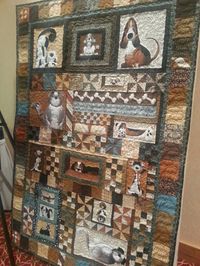 Quilt designed and quilted by Kristina Morrow using a Pound Hounds panel. This quilt was donated to a Humane Society fundraiser.