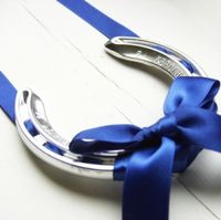 Lucky wedding horseshoe with royal blue ribbon