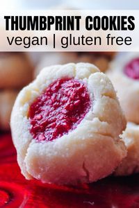 These Gluten Free Thumbprint Cookies are perfect for the holidays or any occasion! Delicious buttery vegan and gluten-free almond flour cookies filled with raspberry jam.