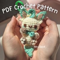 This is a PDF crochet pattern to help you make your own little Leafeon plushie! This pattern will walk you through from the beginning to the end of the construction of the plush, with plenty of pictures and directions to help you along! You will need to know how to do a slip stitch, single crochet, increase, decrease, double crochet, treble crochet, chain, make a magic ring and know how to crochet around a chain to complete this pattern. This pattern is suitable for intermediate crocheters and uses US terminology. Please note that there will be no refunds issued if you buy this pattern mistakenly thinking that this is a finished item.