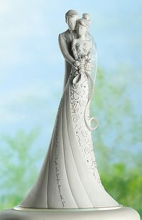 Cake topper. The writing on her dress says "This day I will marry my friend, the one I laugh with, live for, dream with, love."