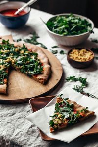 Artichoke and Pickled Onion Pizza With Harissa Tomato Sauce (Vegan): Featuring not one, but two sauces — harissa-tomato and a kale pesto — and a host of other flavor-packed ingredients, this pizza’s lack of melty cheese is totally NBD. (via Faring Well)