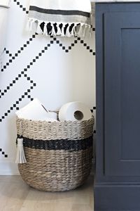 black and neutral Target Threshold woven basket for toilet paper storage