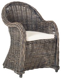 The time-honored wicker patio chair moves indoors with a fashion makeover in this natural Kubu rattan club chair. The golden color of the natural rattan plant fiber makes this eco-friendly chair equally good-looking in a transitional kitchen or sunroom.Disclaimer: Please note that this item is crafted of rattan, and none are exactly alike. Each item will have different shadings, patterning and variations in color. Frame Type: Rattan Finish Surface Treatment: Nc Coating Wood Content: Rattan Kubu