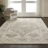 This Fusion Collection rug imbues any room with a distinguished, regal tone, with its wonderfully distressed Persian rug design. The ornate border and center medallion add contrasting greys and neutral tones to the plush, beige field, creating the look of an exotic vintage piece.