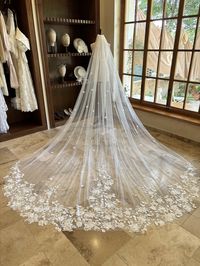 Wedding Veil  Colour: white, ivory, beige, champagne, custom colour Fabric: tulle, lace, beads Applicable scene: wedding  Length: shoulder 20"   elbow 26"  waist 30"  hip 33"  fingertip 36"  knee 45"  waltz 54"    floor 72"  chapel 90 "  church 100"   cathedral 118 "   royal 137 "                                                                                                                               The veil comes with a comb. The veil is made of tulle, I think you might like it. You'll loo