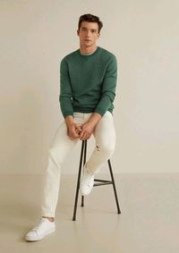 Cream white pants with green sweater and white sneakers. Simple yet stylish.