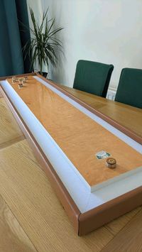 Transform your home into an action-packed gaming area with our brand new Masters Table Shuffleboard. 
This table-top game is very easy to learn but can be quite difficult to master! Players take turns sliding disks down the long board, aiming to get them into the high-scoring areas on the opposite side. The person with highest score, wins!

Shuffleboard is a game that can be enjoyed by people of all ages and is very popular at various events - including Birthday parties, Weddings and Christmas! The table shuffleboard also makes a great addition to any games room and is a must have for any game enthusiast! 