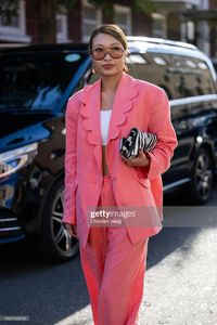 Rosana Lai wears pink suit, zebra bag outside Molly Goddard during... News Photo - Getty Images