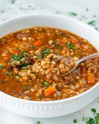 This Beef Barley Soup is rich, satisfying, comfort food in a bowl. A hearty, delicious soup, loaded with tender chunks of beef and veggies. #beefbarley #soup #recipe