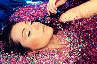 Bathtub photoshoot with sequins instead of glitter.  It would make cleanup much easier.