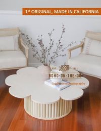 The Original Daisy Table is made by our small business, Boho On The Go LLC! We are Etsy's Pick! Premium, high quality, and handmade in California, USA. Purchased by A-list celebrities!  As seen on Anthropologie, Etsy's newsletter, OC fashion week follow us on instagram: @boho.onthego.socal  to see us in action! We are the inventors! *We have water marked with our brand logo, Boho-On-The-Go SoCal Dimensions: Detachable Table Top and Fluted Base (shipped in two packages) Floral Top 40.75 inches across and 0.75 thick Base is 24 inches wide and 13 inches tall Made with love! Slight imperfections Unstained and uncoated so buyers have the flexibility to alter as needed *NO RETURNS OR CANCELLATION NO EXCEPTIONS Please note that we hand make these item so the shipping time listed is reflected. We