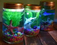 Looking for a fun craft to celebrate the new Disney/Pixar Finding Dory movie? Check out these Light Up Mason Jar Aquariums!