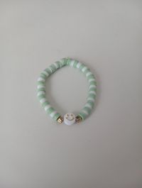 These are some adorable, aesthetic, preppy matcha clay bead bracelets that are the perfect pastel accessory to wear! They'll go with almost any outfit, having versatile wear with its soft and neutral colours. These are stretchable, so they will fit most kids/ older kids and adults wrists comfortably. Please make sure not to overstretch the bracelets as they only stretch so far and could easily snap in half! Sizing: All of these bracelets are 17-18cm long.