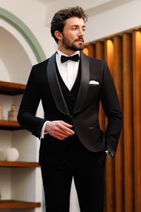 Elevate your formal style with our black slim-fit tuxedo 3-piece set, making a statement of refined elegance. The single-breasted blazer, complete with peak lapels and a fully lined interior, exudes sophistication and attention to detail. #groom #mensstyle #tuxedo #blacktie #blacktuxedo #menattire #menwear #attire #menoutfit #fashion #stylish #dapper