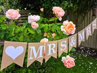 Make your special day truly unforgettable with our same-sex Mrs & Mrs wedding bunting. This elegant bunting is the perfect addition to your wedding decor. Weather you are planning an intimate or a grand celebration, this bunting with six love hearts adds a touch of charm and personality to your venue.  The heart colour can be customised to your wedding theme .  Details: Handmade Decorated with six love hearts All the flags are moveable to suit Made from good quality 280 to 300gsm thick kraft card All the flags are hung on a long waxed cotton cord string Each flag measures approximately 10.50cm across and 14.50cm down  * * * *  UK orders: Due to the thickness of the package being more than 2.5 cm the Royal Mail classify this as a small parcel. International orders: All measured by weight. I