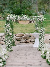 White rose and delphinium ceremony chuppah flowers