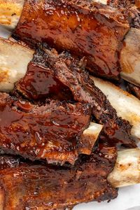 These beef back ribs are insanely juicy and flavorful! Baked in the oven until fall-off-the-bone tender, this foolproof recipe yields perfectly cooked ribs every time. Finish these oven baked beef back ribs with a slathering of your favorite barbecue sauce and enjoy!