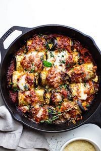 This healthy eggplant rollatini is such an easy family dinner that is gluten free friendly and absolutely delicious. You will fall in love with the taste of this classic Italian dish that is easy to make and full of vibrant flavors! | asimplepalate.com #eggplantrollatini #eggplant #Italian