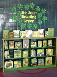 Be Seen Reading Green. March book display with 3-D clovers and any book with a green cover. These color-themed displays are some of our most popular!