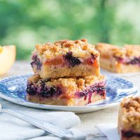 The perfect mix of chewy and crispy, these bars travel well, cut and wrapped individually or packed in an air tight container. Blueberry-Peach Crumble Bars   Save Recipe Print Ingredients CRUMBLE 3 cups all-purpose flour ¾ cup granulated sugar ¾ cup firmly packed light brown sugar ¾ cup plain yellow cornmeal 1 teaspoon kosher salt …