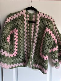 Beautiful handmade crochet hexagon cardigan. Variations of pinks and greens. Straight sleeves and somewhat cropped :)