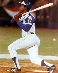 Hank Aaron as he watches his 715th home run sail toward the upper deck of then Atlanta-Fultion County Stadium...thus breaking Babe Ruth's long standing home run record.