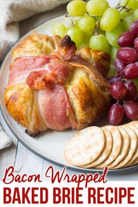 Bacon Wrapped Baked Brie in Puffy Pastry Recipe. A fabulous holiday appetizer with puff pastry wrapped around hot molten brie cheese, and a bacon bow! #ASpicyPerspective via @spicyperspectiv