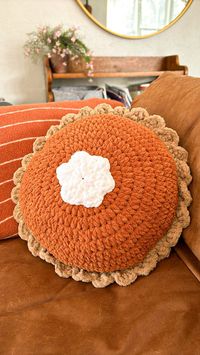 New to the shop!     This pumpkin pie pillow is the perfect decor for any living room, bedroom, or dorm.  I use blanket yarn to create this incredibly soft and doughy pillow that is perfect for fall.  Measurements are: Diameter 17in, width 6in