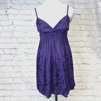 This purple Topshop vintage dress is a perfect addition to any wardrobe. The sleeveless design with a zip closure and a bow accent on the front makes it suitable for prom, party or cocktail events. The dress is made of viscose material which is machine washable and suitable for all seasons. Its fit & flare style, short dress length and purple colour with Y2K and 90s design add a touch of vintage to your look. This dress is a UK size 8 and is perfect for formal occasions. Helpful Information All Measurements are approximate If you would like to buy more than 1 item from our shop, then we would be delighted to combine the postage costs. Please message us before purchasing for more information. We are here to answer any questions - 10am and 4pm, Mon to Fri (excluding Bank Holidays). Our aim i